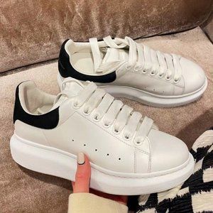 McQueen black tail and white shoes